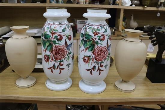 Pair of French 19th century opaline glass tall vases, decorated with rose sprays on a white ground and another pair of opaline vases